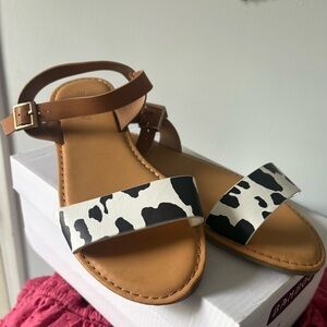 BAMBOO Tan Sandals with Black & White Cow Print Strap